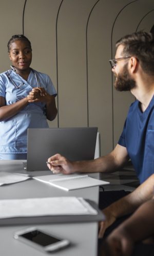 side-view-healthcare-professionals-meeting